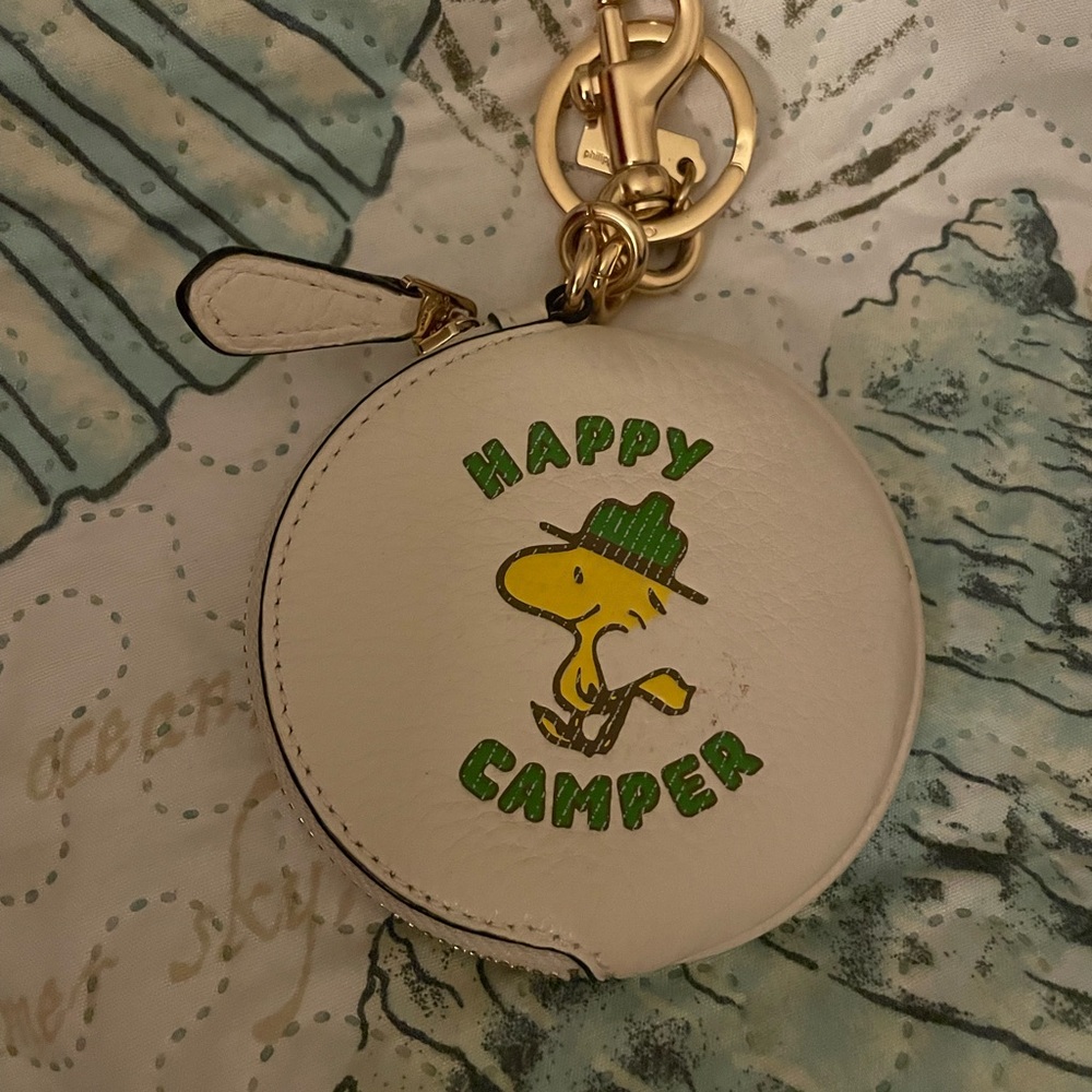 White Round Keychain with Woodstock Design
